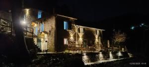 an old stone house at night with lights at La quiete accesa in Vernazza +20 photos