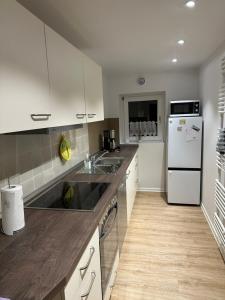Η κουζίνα ή μικρή κουζίνα στο Nordsee Ferienhaus A und O