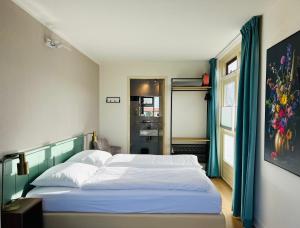 Ένα ή περισσότερα κρεβάτια σε δωμάτιο στο Simmerwille B&B- Camping- Bootverhuur