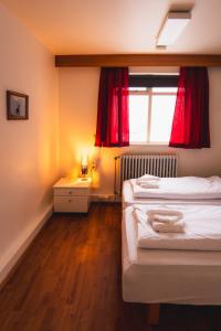 Postel nebo postele na pokoji v ubytování Studlagil INN Hostel