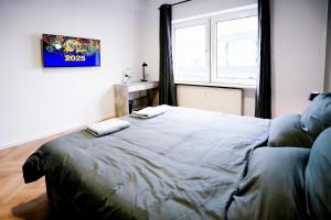 Postel nebo postele na pokoji v ubytování J&JBermudaStay a Luxurious Double-Bedroom with a Private Bathroom and Shared Kitchen in Bochum Center-Bermuda3Eck