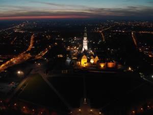 an aerial view of a city at night at Apartament Sunrise in Częstochowa