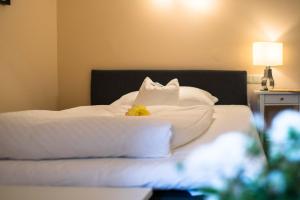 Postel nebo postele na pokoji v ubytování Hotel Leicht