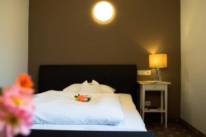 Postel nebo postele na pokoji v ubytování Hotel Leicht