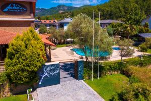an aerial view of a resort with a swimming pool at Mesken Inn Göcek Hotel in Göcek