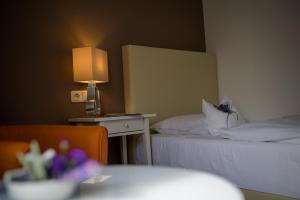 Postel nebo postele na pokoji v ubytování Hotel Leicht