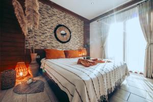 a bedroom with a large bed with a large window at Mesken Inn Göcek Hotel in Göcek +42 photos