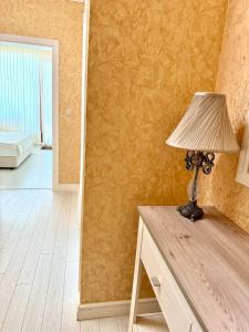 a lamp sitting on a dresser in a room at La Mer Welcome in Golden Sands +41 photos