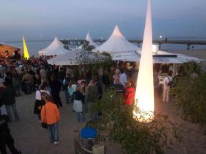 a crowd of people walking around a crowd of tents at holiday apartment with 2 bedrooms in Timmendorfer Strand