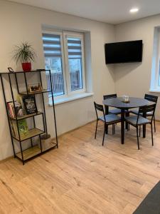 TV a/nebo společenská místnost v ubytování Cozy apartment in Karmelava