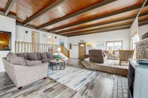 a living room with a couch and a table at Gleneden BeachFront Getaway in Lincoln Beach