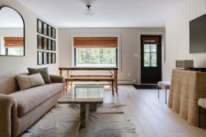 a living room with a couch and a table at The Bend Micro Resort in Phoenicia