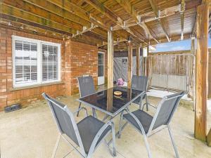 a patio with a table and four chairs at Private - Spacious with Jacuzzi and Great Location in Mississauga