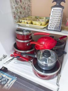 a pile of pots and pans in a refrigerator at Private - Spacious with Jacuzzi and Great Location in Mississauga