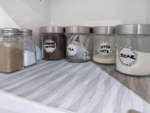 a group of jars of food in a refrigerator at Private - Spacious with Jacuzzi and Great Location in Mississauga