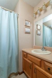 a bathroom with a sink and a shower at Cozy Smoky Mountain Escape w/ Private Deck & Community Pool in Pigeon Forge +32 photos
