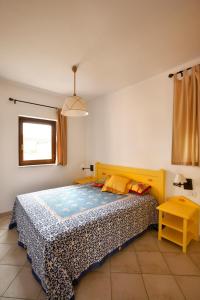 A bed or beds in a room at Argonauti Residence