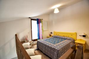 A bed or beds in a room at Argonauti Residence