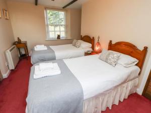 Postel nebo postele na pokoji v ubytování Rose Cottage