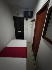 Rúm í herbergi á Hotel Tucan Pereira