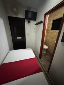 Rúm í herbergi á Hotel Tucan Pereira