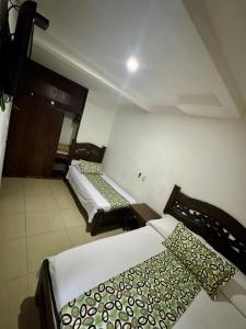 Rúm í herbergi á Hotel Tucan Pereira