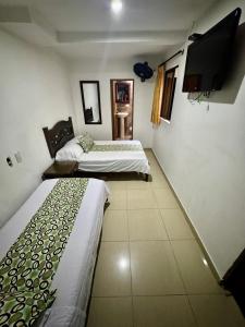 TV a/nebo společenská místnost v ubytování Hotel Tucan Pereira + 37 fotografií