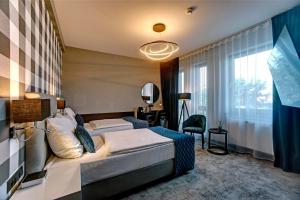 Postel nebo postele na pokoji v ubytování Hotel Sanova