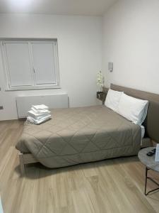 Postel nebo postele na pokoji v ubytování B&B La Terrazza Polifrone