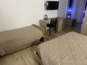 Postel nebo postele na pokoji v ubytování B&B La Terrazza Polifrone