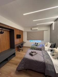 En eller flere senge i et værelse på 12 Apartamento Estiloso!