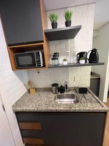 Køkken eller tekøkken på 12 Apartamento Estiloso! + 23 billeder