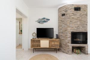Μια τηλεόραση ή/και κέντρο ψυχαγωγίας στο Casa Farol View