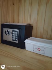 a microwave sitting on a counter next to a box at La Hijuela in El manzano historico