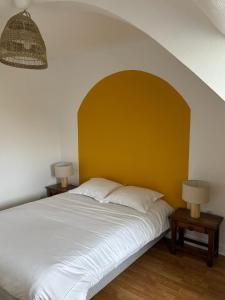 Postel nebo postele na pokoji v ubytování Le Manoir de Conteville