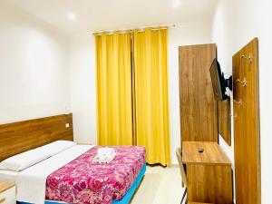 Postel nebo postele na pokoji v ubytování Milazzo Suites