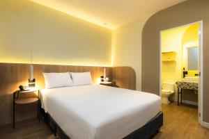 Tempat tidur dalam kamar di Hotel Solec Piura