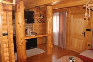 a log cabin with a desk in a room at Cottage retreat- Skadar Lake in Virpazar +43 photos