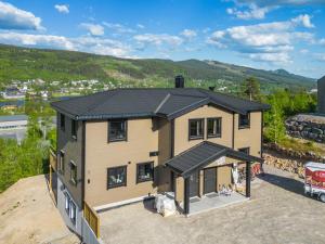 an aerial view of a house with a roof at Ski inn ski ut leilighet in Trysil