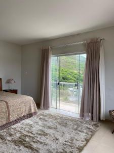 Postel nebo postele na pokoji v ubytování Refúgio Santo Hilário