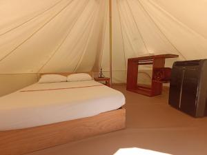 Postel nebo postele na pokoji v ubytování Glamping Campamento Cuetzalan