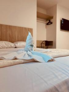 Postel nebo postele na pokoji v ubytování Hotel Astor Cucuta