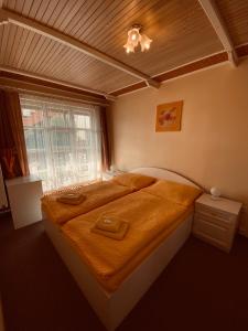 Uma cama ou camas num quarto em Dalmo