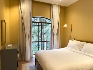 Posteľ alebo postele v izbe v ubytovaní Boutique Residence Villa Atouta-Lemon Spaces Maadi