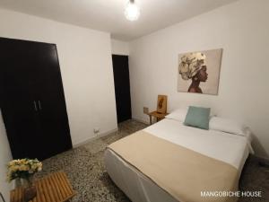 Postel nebo postele na pokoji v ubytování MANGO BiCHE - HOUSE