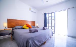 Postel nebo postele na pokoji v ubytování Terra Cozumel + 32 fotografií