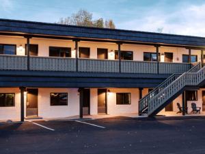 a building with a staircase and a parking lot at Western Lodge in Steamboat Springs