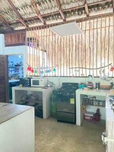 a kitchen with a counter and a stove in it at la casablanca moñitos in Moñitos