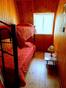 a bedroom with two bunk beds and a window at Casa en Potrerillos in Potrerillos