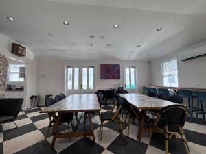 a classroom with tables and chairs in a room at K2 Brisbane in Brisbane